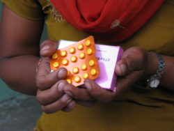 Community health worker with health supplies